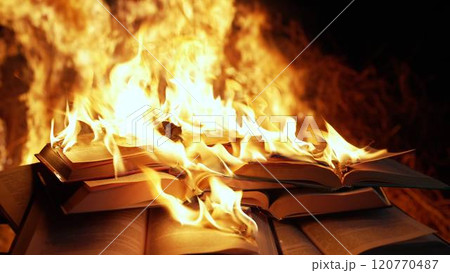 Open book is on fire, pages are engulfed in flames. Concept of censorship, prohibition of freedom Open book is on fire, pages are engulfed in flames. Concept of censorship, prohibition of freedom 120770487