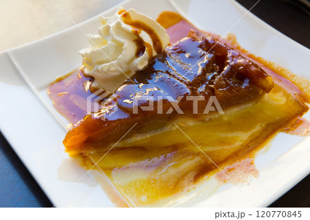 Apple pie with whipped cream 120770845