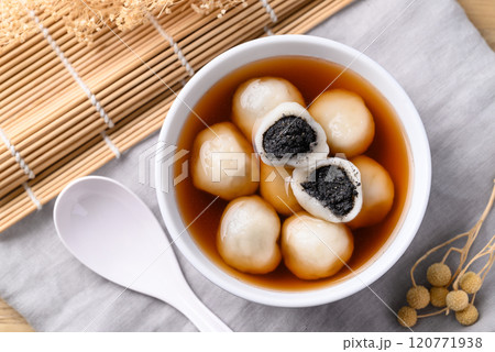Tangyuan (Chinese sweet dumpling), Glutinous rice flour filling with black sesame in ginger syrup Tangyuan (Chinese sweet dumpling), Glutinous rice flour filling with black sesame in ginger syrup 120771938