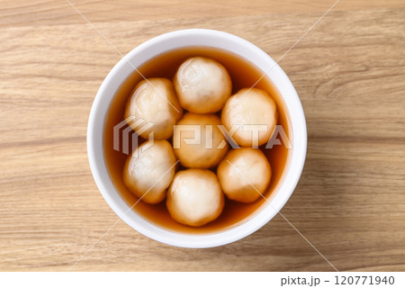 Tangyuan (Chinese sweet dumpling), Glutinous rice flour filling with black sesame in ginger syrup Tangyuan (Chinese sweet dumpling), Glutinous rice flour filling with black sesame in ginger syrup 120771940