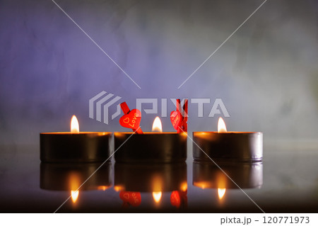 Christmas candles burning at night. 120771973