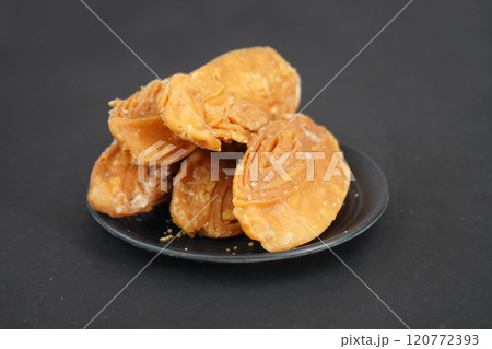 Delicious khaja of puri in black plate and background 120772393