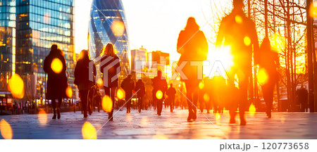 Busy City Street at Sunset with Silhouettes of People Walking 120773658