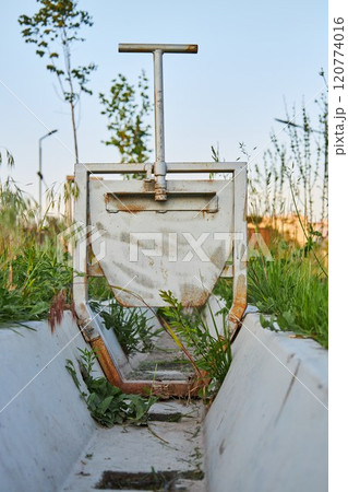 Irrigation ditch, drained aryk in city park 120774016