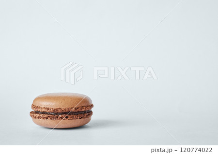 One brown French Macaron, macaroon cake with coffee and chocolate flavor One brown French Macaron, macaroon cake with coffee and chocolate flavor 120774022