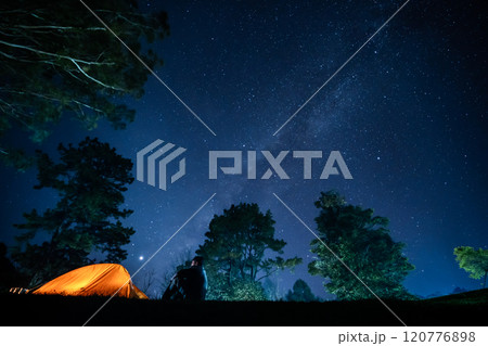 nature traveling with orange camping tent on mountain with milky way background nature traveling with orange camping tent on mountain with milky way background 120776898