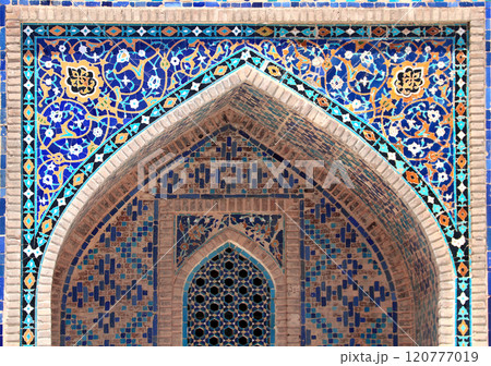 Decorative arch in Sher-dor Madrassah, Registan, Samarkand, Uzbekistan. Detail of arch with tile decor, Sher Dor (Lion) Medressa, part of Registan Ensemble 120777019