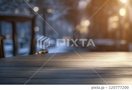wooden table top with a blurred winter background 120777200