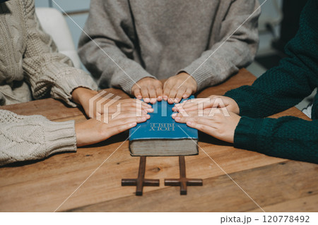 Christians are congregants join hands to pray and seek the blessings of God. 120778492