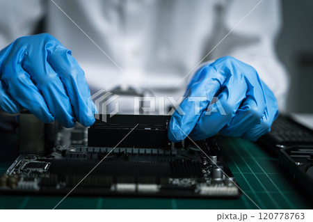 killed hands repairing electronic devices with precision. technology repair, technician expertise, and modern electronic maintenance. killed hands repairing electronic devices with precision. technology repair, technician expertise, and modern electronic maintenance. 120778763