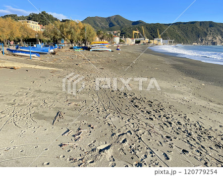 Sand and beach on the Mediterranean Sea. Traditional boats and buildings in fishing town of Riva Trigosa, Italy. Sand and beach on the Mediterranean Sea. Traditional boats and buildings in fishing town of Riva Trigosa, Italy. 120779254
