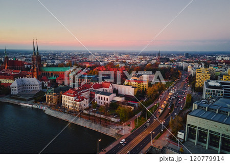 Aerial view of European city with Gothic churches and historic architecture in autumn season. St. John Cathedral on Ostrow Tumski at sunset. Cityscape panorama of Wroclaw, Poland 120779914