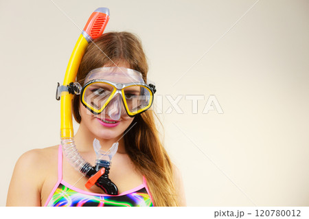 Woman with snorkeling mask having fun Woman with snorkeling mask having fun 120780012