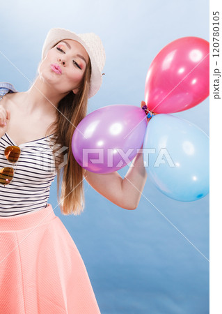 Woman summer joyful girl with colorful balloons 120780105