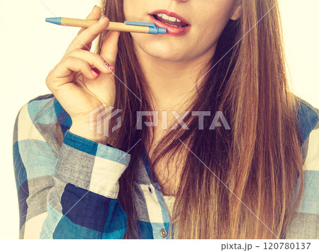 Thinking woman with holding pen 120780137