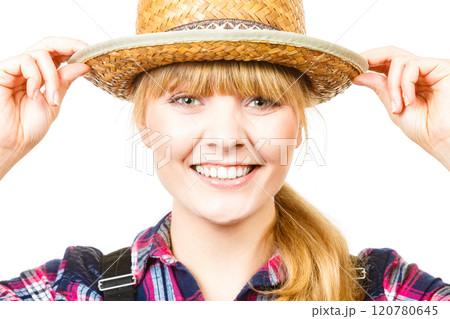 Portait smiling woman wearing sun hat and shirt Portait smiling woman wearing sun hat and shirt 120780645