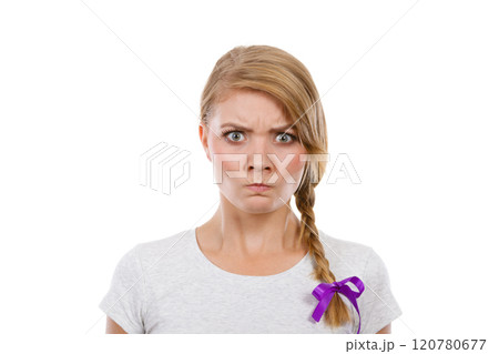 Teenage girl in braid hair making angry face 120780677