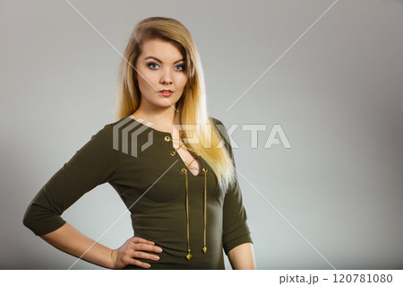 Attractive blonde woman wearing tight green khaki top Attractive blonde woman wearing tight green khaki top 120781080
