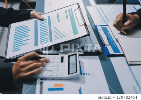 Fund managers team consultation and discuss about analysis Investment stock market at office 120782451