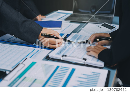 Fund managers team consultation and discuss about analysis Investment stock market at office 120782452