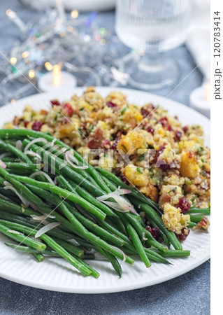 Green beans with caramelized shallots and Traditional Cranberry pecan cornbread dressing, vertical Green beans with caramelized shallots and Traditional Cranberry pecan cornbread dressing, vertical 120783414