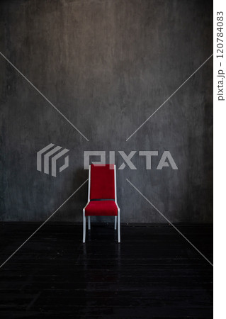 One Red Vintage Chair In Dark Room Interior 120784083