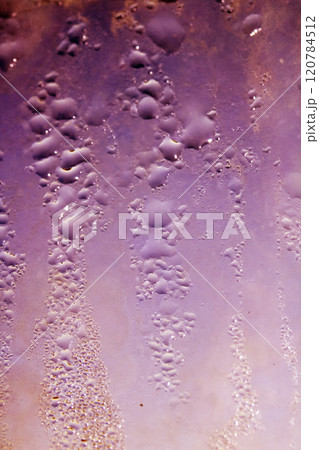 Deilcate Rain Drops of Water on Glass in a Red Pink Glow for Background Deilcate Rain Drops of Water on Glass in a Red Pink Glow for Background 120784512