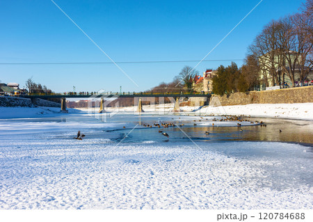 uzhhorod, ukraine - 19 jan, 2017: bridge on the river uz in winter. sunny weather. urban landscape of the old city downtown uzhhorod, ukraine - 19 jan, 2017: bridge on the river uz in winter. sunny weather. urban landscape of the old city downtown 120784688