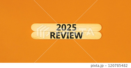 Planning 2025 review new year symbol. Concept words 2025 Review on beautiful wooden sticks. Beautiful orange background. Business 2025 review new year concept. Copy space. Planning 2025 review new year symbol. Concept words 2025 Review on beautiful wooden sticks. Beautiful orange background. Business 2025 review new year concept. Copy space. 120785482