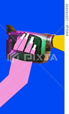 Contemporary art collage. Hand holding vintage camcorder, reminiscent of early days of home video recording. 120785830