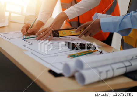 Construction and structure concept of Engineer or architect meeting for project working with partner and engineering tools on model building and blueprint in working site, contract for both companies. 120786896