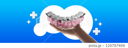 Contemporary art collage. Dental model with braces held in hand, surrounded by medical symbols, highlighting orthodontics and teeth alignment care. 120787409