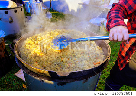 Turkish pilaf is traditionally cooked in large cast iron cauldron Turkish pilaf is traditionally cooked in large cast iron cauldron 120787601