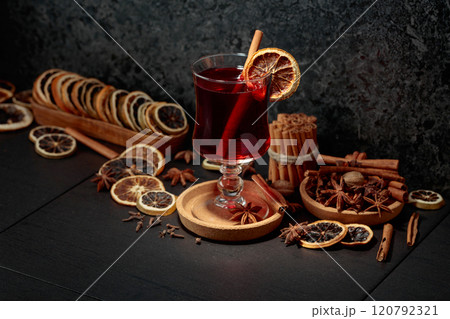 Mulled wine with ingredients and dry orange slices. Mulled wine with ingredients and dry orange slices. 120792321