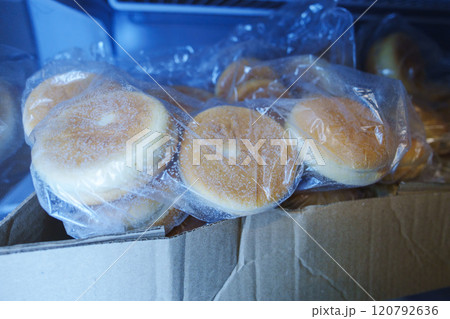 Frozen hamburger buns in the fridge. Selective focus Frozen hamburger buns in the fridge. Selective focus 120792636