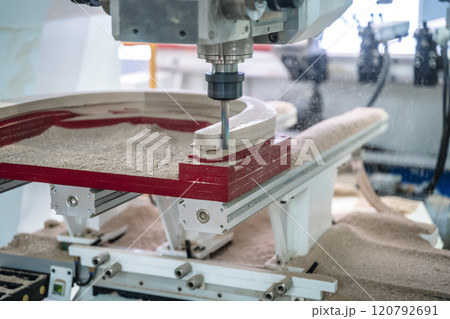 Manufacture of wooden furniture on a CNC machine in production. Woodworking. 120792691
