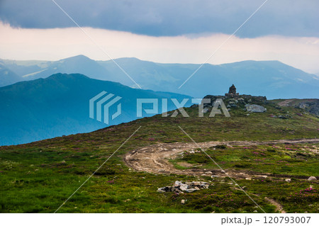 Mountain path on the blue sky background 120793007