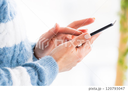 Female hands using phone Female hands using phone 120793047