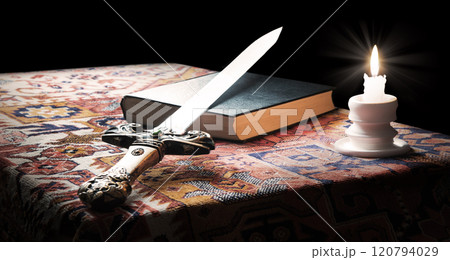 Iron sword on old bible Iron sword on old bible 120794029