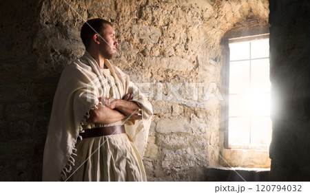 Ancient man at the window 120794032
