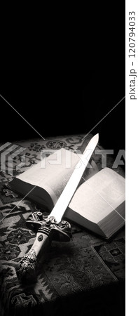 Old sword on the bible Old sword on the bible 120794033