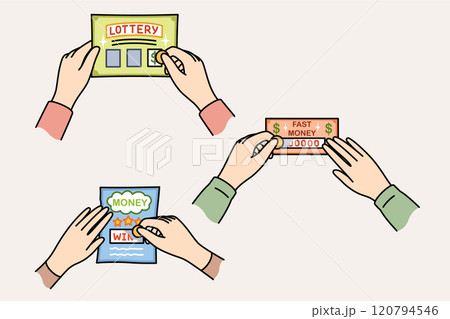Lottery tickets in hands of gambling people who erase protective layer to find out winning amount 120794546