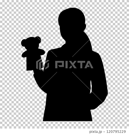 Silhouette of a female nursery teacher with a puppet 120795229