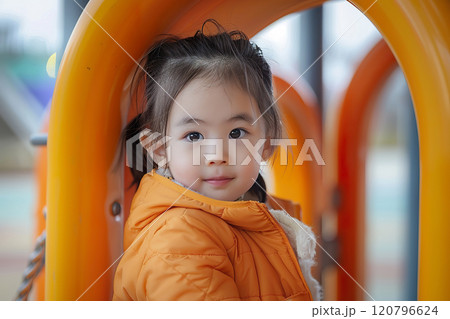 Asian Boy Playing at Schoolyard in autumn jacket. 120796624