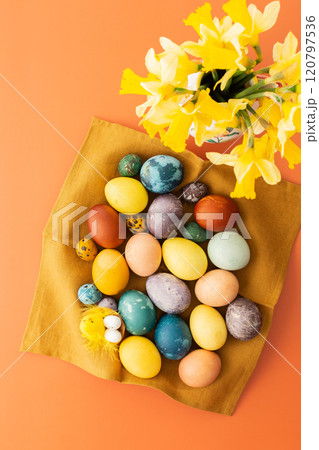 Naturally dyed Easter eggs on a napkin 120797536