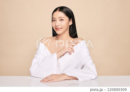 Beautiful young asian woman with clean fresh skin on beige background, Face care, Facial treatment, Cosmetology, beauty and spa, Asian women portrait. Beautiful young asian woman with clean fresh skin on beige background, Face care, Facial treatment, Cosmetology, beauty and spa, Asian women portrait. 120800309