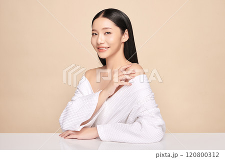 Beautiful young asian woman with clean fresh skin on beige background, Face care, Facial treatment, Cosmetology, beauty and spa, Asian women portrait. 120800312