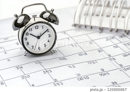 Vintage Alarm Clock on a Planner Calendar Sheet, Concept of Time Management, Scheduling, and Daily Planning for Productive Lifestyle and Effective Time Usage 120800867