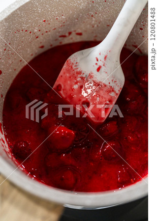 In a small saucepan, the measured ingredients come together - allowing the delicious Raspberry Cake Filling to simmer and infuse with delightful flavors. 120801488
