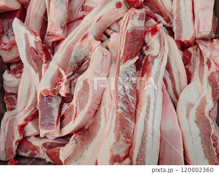 Fresh Cuts of Raw Pork Belly on a Market Stall Display 120802360